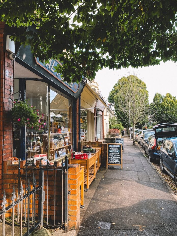 A row of parked cars sitting next to each other on a street